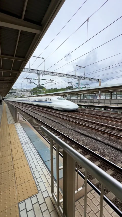 A view of the bullet train passing through Odawara Station Stock Footage 279024710