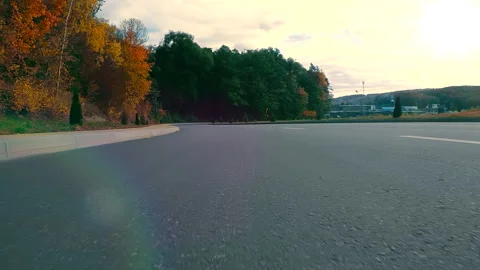 View from the bumper of the car on the highway. The camera looks at the road Stock Footage 252213124