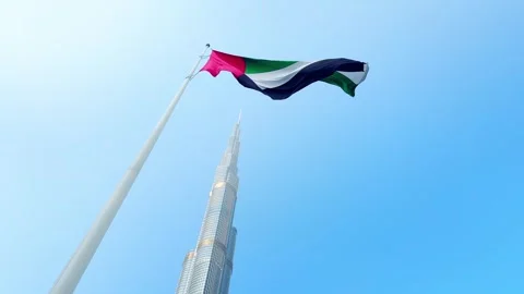 View of Burj Khalifa skyscraper and flag of United Arab Emirates Stock Footage 271469268