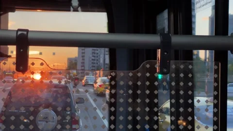View from bus on transport traffic. Bus crossing intersection. Sunset in city Vídeo Stock 196203079