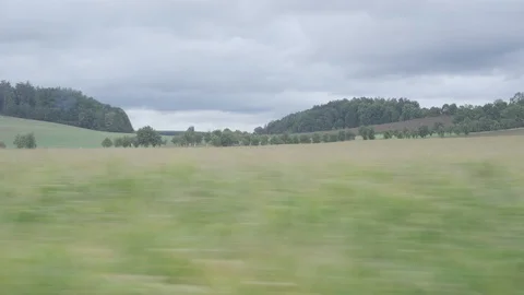 View from the bus window to the passing beautiful landscape Stock Footage 115766427