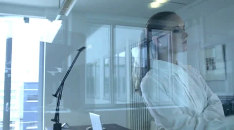 View of a businesswoman through a glass partition Stock Footage