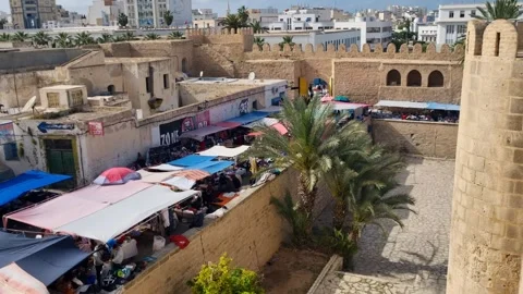 View of the bustling bazaar in central Sousse, Tunisia, with people moving Stock Footage 336626295