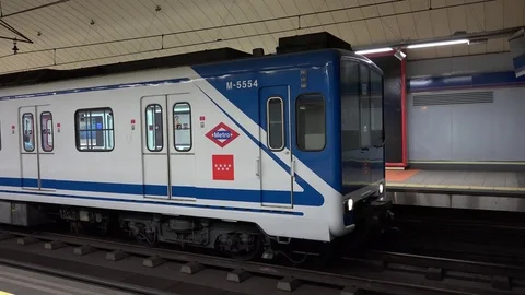 View of busy metro train traffic in Madrid illuminated underground tunnel subway Stock Footage 81979152