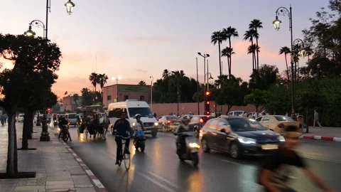 View of the busy traffic in Marrakech, Morocco during sunset Video stock 132343896