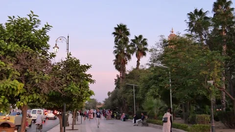 View of the busy traffic in Marrakech, Morocco during sunset Video stock 132343898