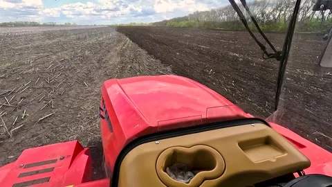 View from the cab of an agricultural tractor on the field. Stock Footage 254909934