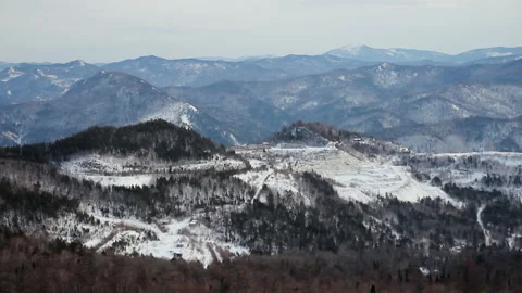 View from Cab of Heavy Snow Plowing Equipment. Ratrak in Mountains. Clears Way Stock Footage 146877632