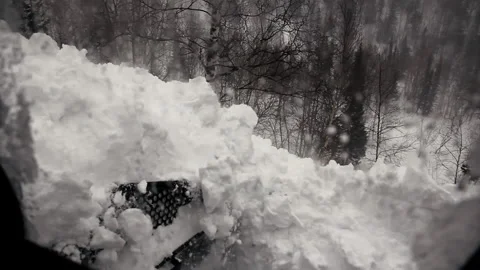 View from Cab of Heavy Snow Plowing Equipment. Ratrak in Mountains. Clears Way Stock Footage 146948264