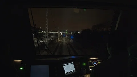 View from the cab of a moving high-speed train at night on an industrial area Video stock 123628651