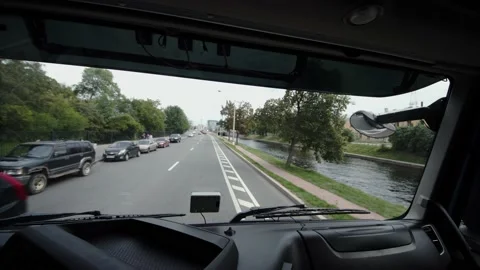 View from cab of truck moving along the city embankment Stock Footage 204095102