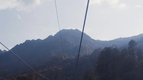 View from the cabin of the funicular climbing to the top of the rocky mountain. Stock Footage 107031523