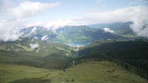 View of cable car and clearing clouds over Zell am See from Schmittenhoehebahn Stock Footage 320888162