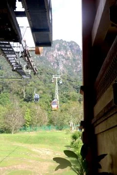 View of cable car from cable car station going up toward hill Stock Photos