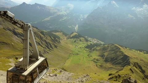View of the cable car gliding through the Lauterbrunnen Valley in Stock-Footage 256774535