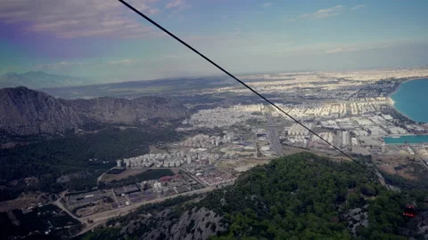 View from a cable car over the coastline and town below Stock Footage 203960550