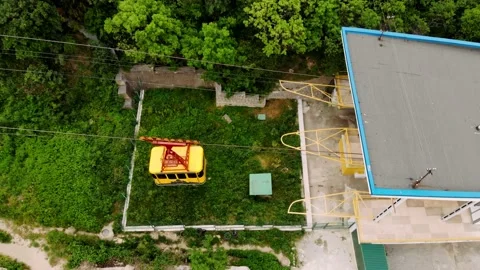 View on the cable car with a rising funicular, mountains and green forest Stock Footage 170379605