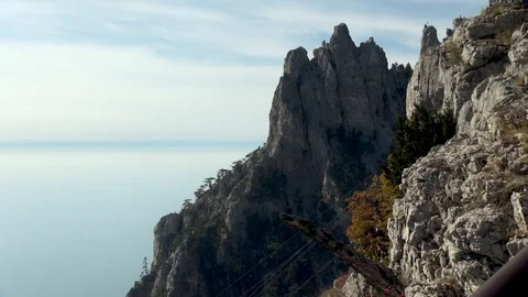 View of cable car through rocks on Mount Ai Petri. Stock Footage 106607823
