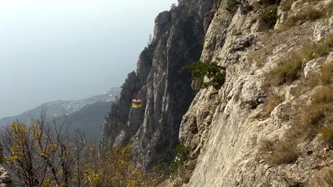 View of cable car through rocks on Mount Ai-Petri. Video stock 106774925