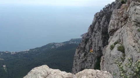 View of cable car yellow cab and a sea from mount Ay Petri . Crimea Stock Footage 82299005