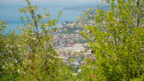 View on cableway with moving funicular and coastal Batumi city from mountains. Stock Footage 247248729