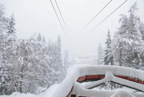 View from cableway station in the strong snowfall in the mountains Stock Photos