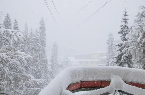 View from cableway station in the strong snowfall in the mountains Stock Photos