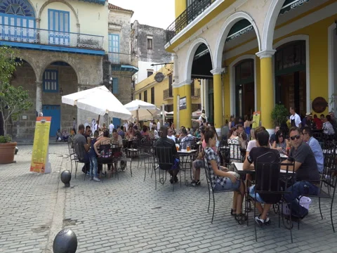 View to cafe with big colonial columns on central square in Havana at summer Stock Footage 69499722