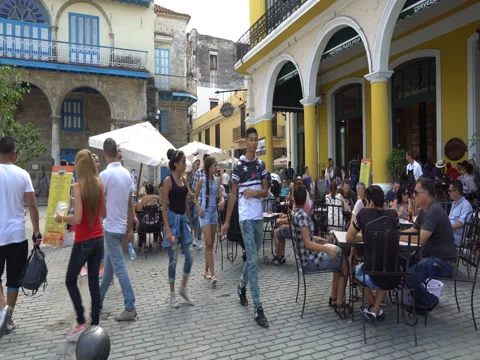 View to cafe on central square with big colonial columns in Havana at summer Stock Footage 69528858