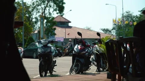 View from the cafe to the parking of mopeds. Hot Asian day Thailand, Phangan Stock Footage 237745651