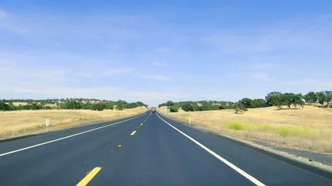 A view of a California freeway through the windshield of a car. Driving on a Stock Footage 199595776