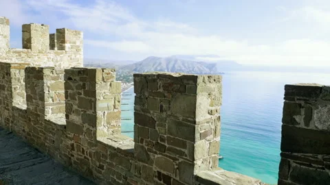 View of the calm blue sea from the tower of the stone fortress. 4K Stock Footage 145684543