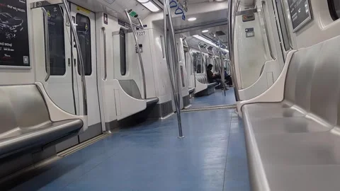 View of calm metro train interior with few passengers sitting in quiet urba.. Vídeos de archivo 335873990