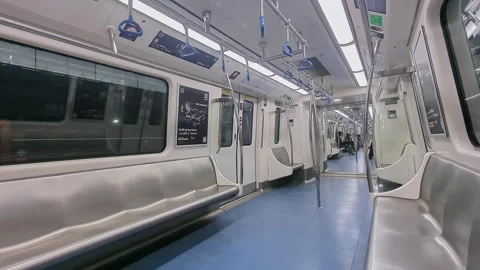 View of calm metro train interior with few passengers sitting in quiet urba.. Stock Footage 335874161