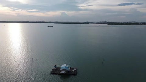 The view of the calm, sun-drenched waters from above Video stock 325194180