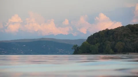 View of the Calm Water Suface and Hills in Evening Light (Lake Trasimeno, Italy) Stock Footage 245284093