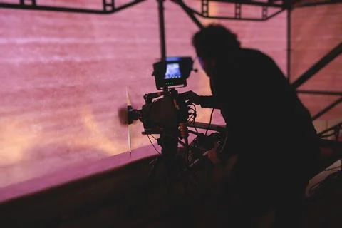 View of a camera man operator working during tv reportage, online broadcast.. Stock Photos