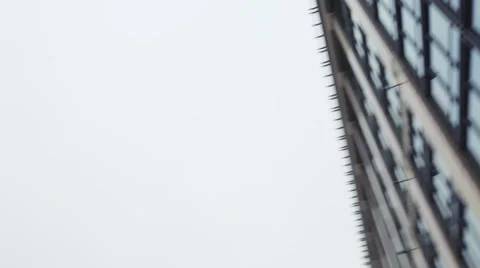 View of Camera Right at High-Rise Building. Grey Sky, Mainly Cloudy. Rapid Stock Footage 65219979