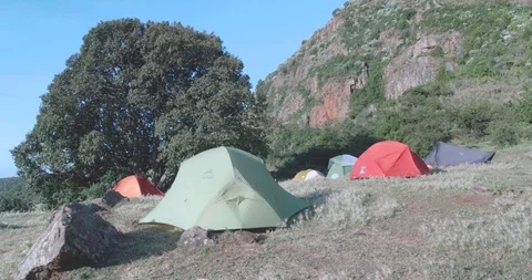 View of Camping tents below a mountain Stock Footage 108495200