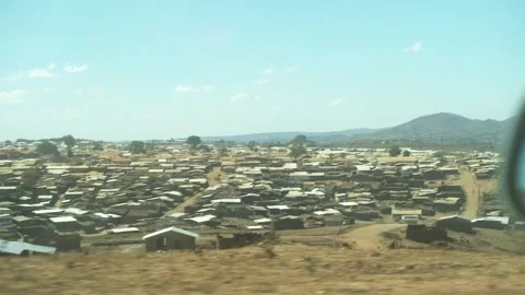 A View of Camps and Mountains Through the Window While Driving Stock Footage 303794493