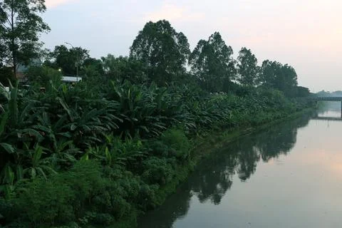 View of the canal with a bridge in the middle Stock Photos