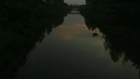 View of the canal with a bridge in the middle Stock Photos