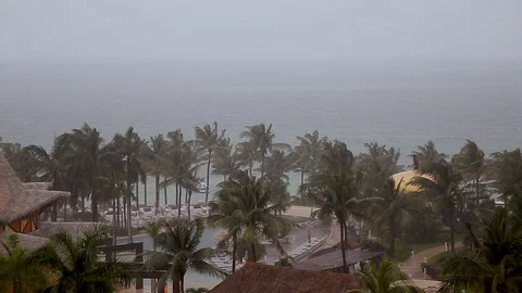 View from a Cancun resort looking out onto the ocean as a tropical storm bears Stock Footage 104221166