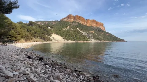 View of Cap Canaille cliff from rocky beach. Cap Canaille, Cote d'Azur, France Stock Footage 244269031