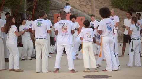 View of capoeira practitioners training in Carcavelos, Portugal. Video stock 343878642