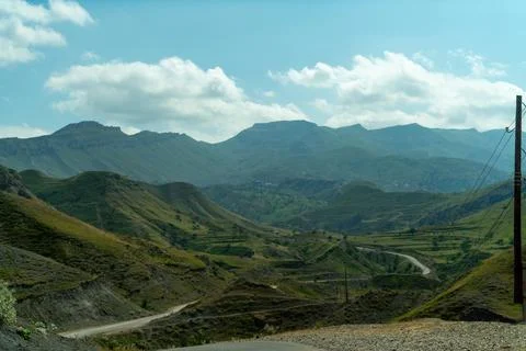 View from the car of an asphalt road in the mountainous area of Dagestan Stock Photos