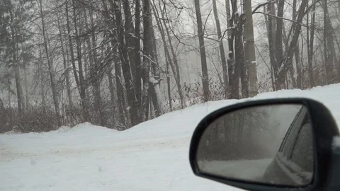 View from the car. Beautiful snow falls. Stock Footage 100010432
