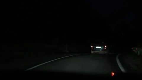 View of the car from behind at night road Stock Footage 162442677