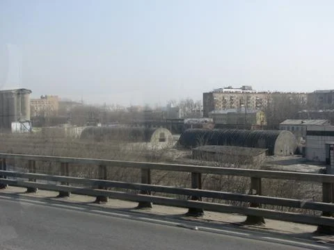 View from the car on the bridge over the river and the city Stock Photos