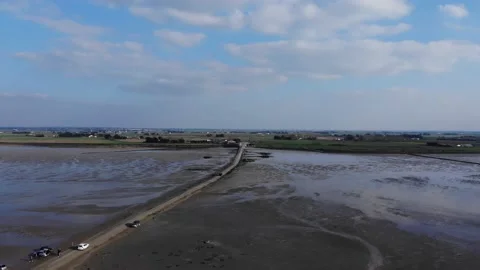 View of car crossing The passage du Gois, Noirmoutier island. France. Aerial Stock Footage 150470232